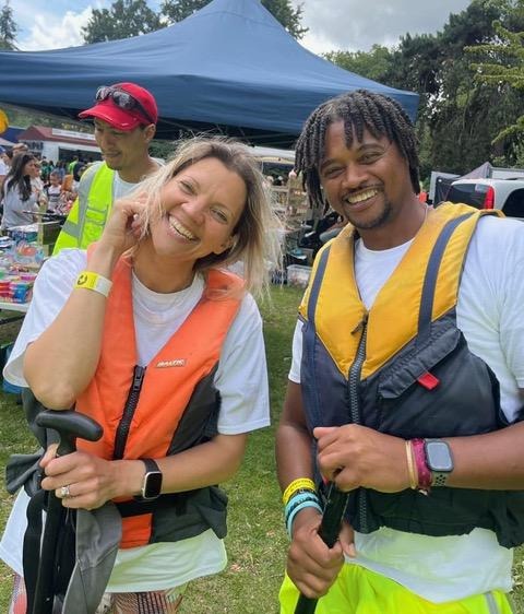 A person and person in life vests smiling

Description automatically generated